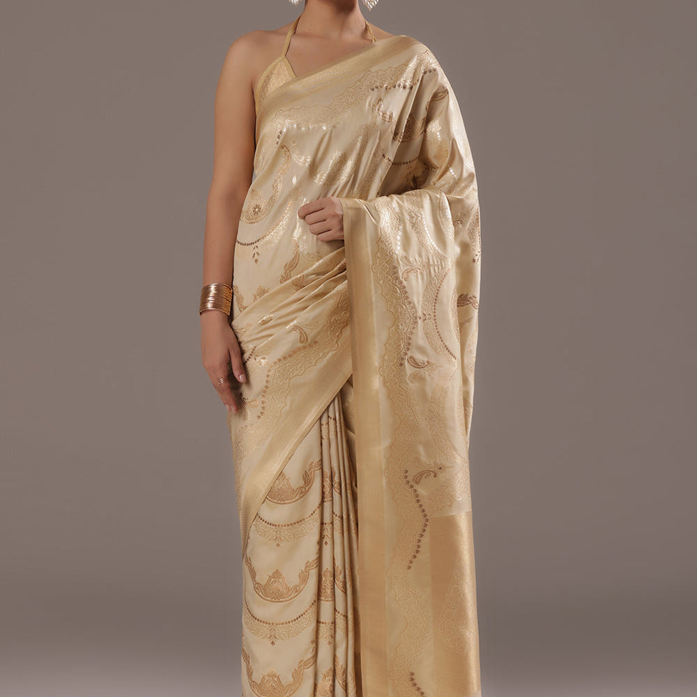 A Touch of Royalty: Cream Banarasi Silk Saree with Golden Zari Accents